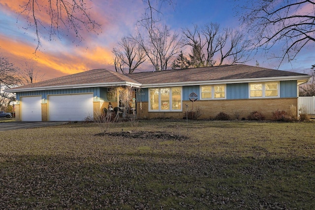 single story home featuring a garage