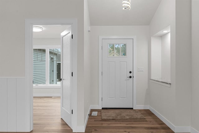 foyer with hardwood / wood-style floors and a healthy amount of sunlight