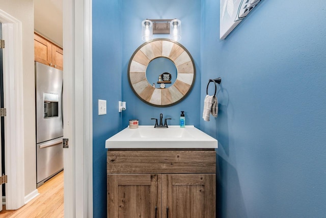 bathroom featuring wood-type flooring and vanity