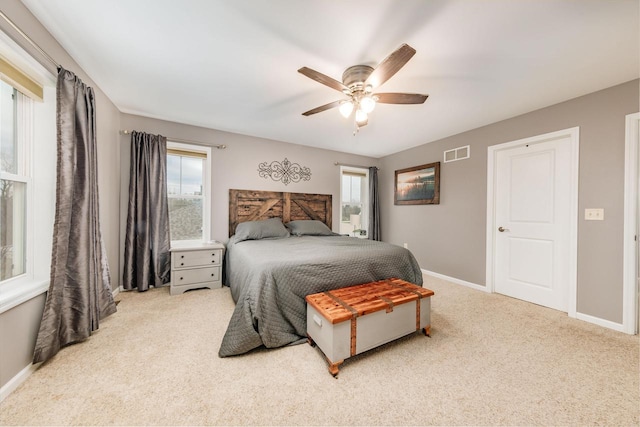 bedroom with light colored carpet and ceiling fan