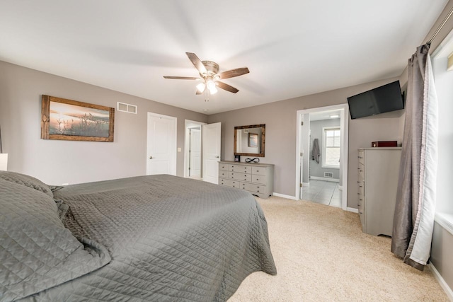 bedroom featuring ceiling fan and light carpet