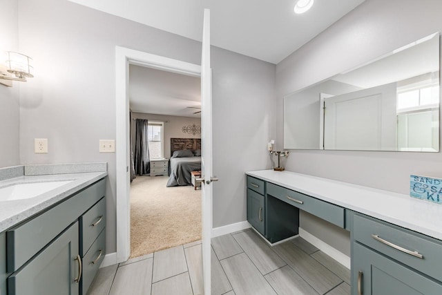 bathroom featuring vanity and ceiling fan