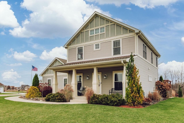 view of front of property featuring a porch and a front yard