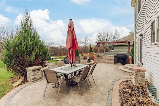 view of patio / terrace featuring a pergola and a grill