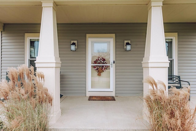 property entrance featuring a porch