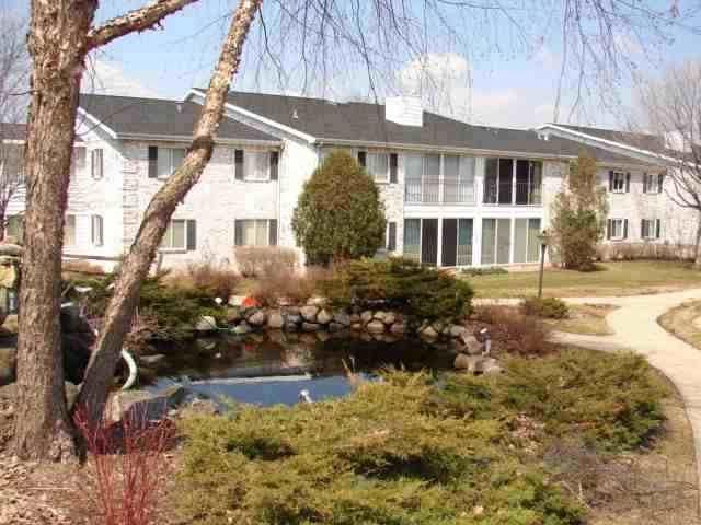 back of house with a sunroom