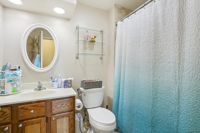 bathroom featuring vanity and toilet