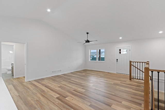 entrance foyer with ceiling fan, light hardwood / wood-style floors, and vaulted ceiling