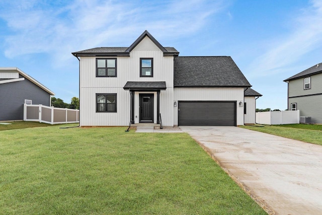 modern farmhouse style home with central AC unit, a front yard, and a garage