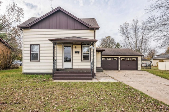 view of front of property with a front lawn and a garage