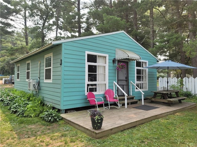 view of outbuilding with a yard