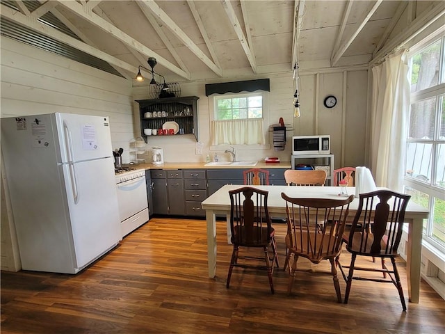 kitchen featuring vaulted ceiling with beams, white appliances, dark hardwood / wood-style floors, and sink