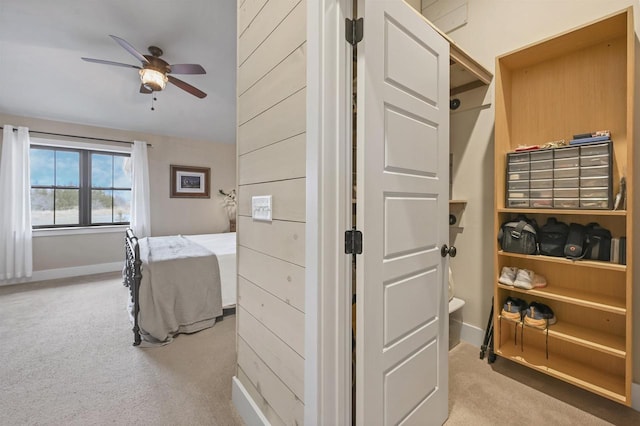 bedroom with light carpet and ceiling fan