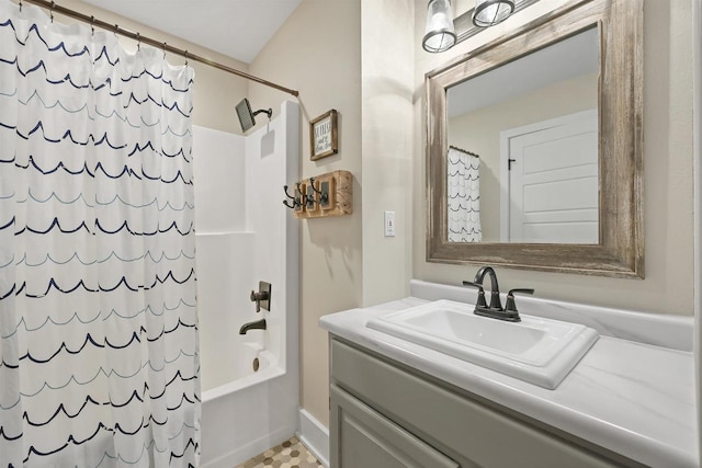 bathroom with shower / bath combo with shower curtain and vanity