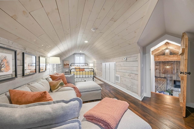 bedroom with wooden walls, dark hardwood / wood-style flooring, wood ceiling, and vaulted ceiling