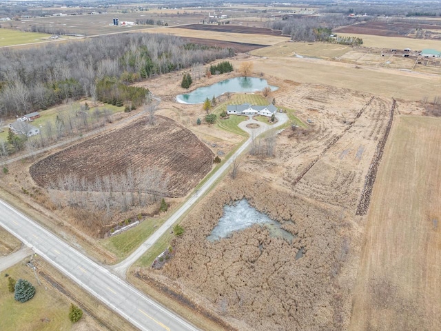 bird's eye view with a water view and a rural view