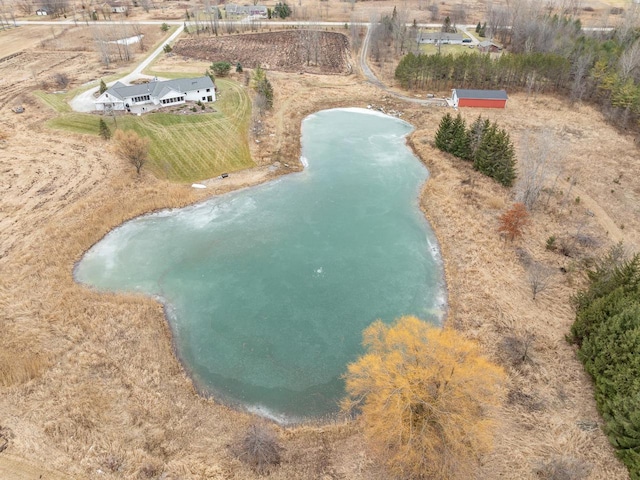 drone / aerial view featuring a water view and a rural view