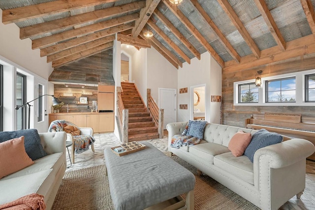 living room featuring beamed ceiling, high vaulted ceiling, and plenty of natural light