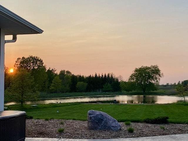 yard at dusk with a water view