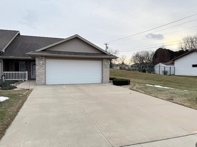 exterior space with a lawn and a garage