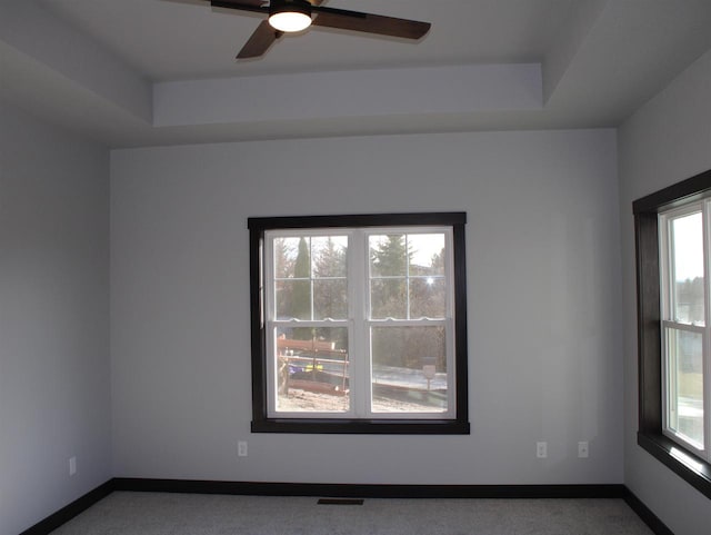 W4241 Hilltop Dr, Fond Du Lac, WI 54937 - carpeted spare room with a tray ceiling and ceiling fan