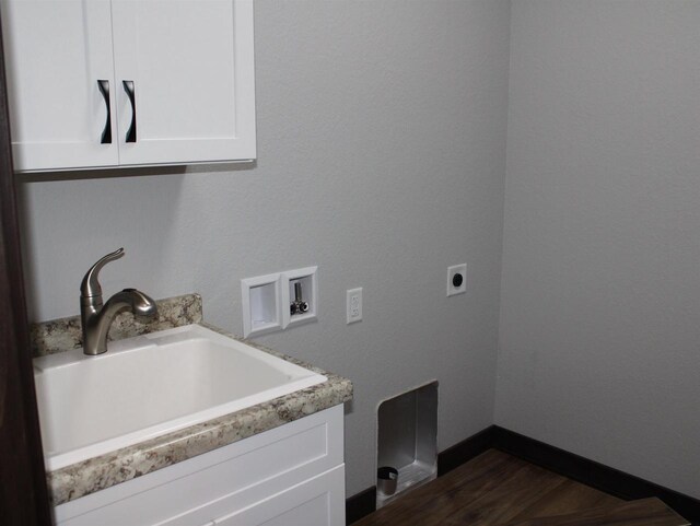 W4241 Hilltop Dr, Fond Du Lac, WI 54937 - washroom featuring sink, cabinets, dark wood-type flooring, electric dryer hookup, and hookup for a washing machine