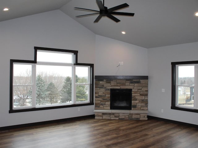 unfurnished living room with ceiling fan, a fireplace, high vaulted ceiling, and dark wood-type flooring