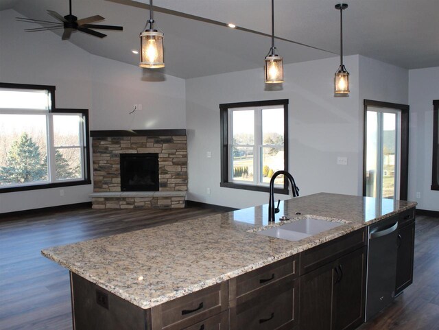 W4241 Hilltop Dr, Fond Du Lac, WI 54937 - kitchen with a fireplace, sink, pendant lighting, a center island with sink, and dishwasher