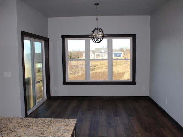 W4241 Hilltop Dr, Fond Du Lac, WI 54937 - unfurnished dining area with dark hardwood / wood-style flooring and a chandelier