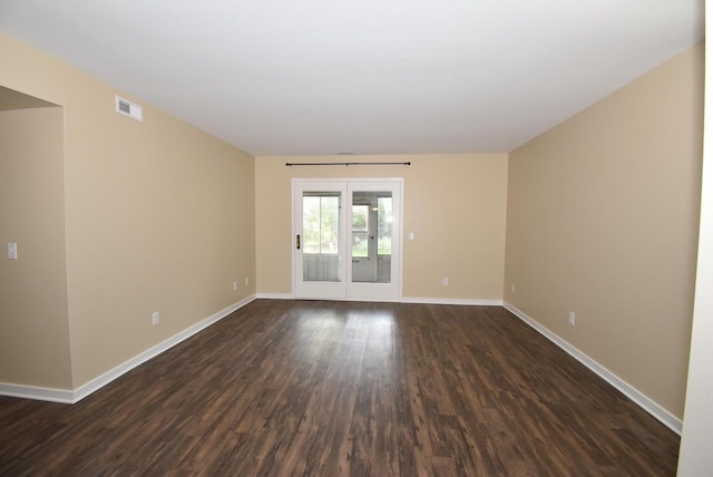 spare room featuring dark hardwood / wood-style floors