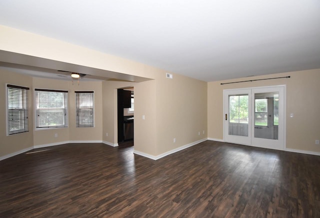 spare room featuring ceiling fan and dark hardwood / wood-style floors