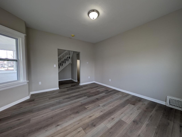 spare room featuring hardwood / wood-style flooring