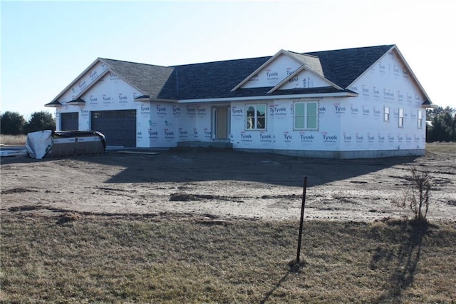 property in mid-construction featuring a garage