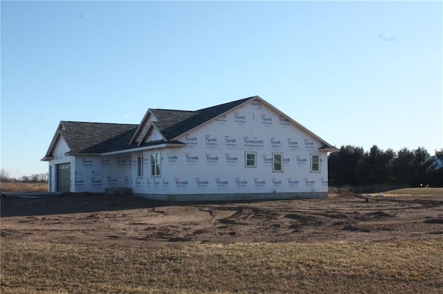 view of side of property with a garage