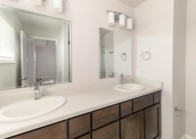 bathroom with double vanity and a sink