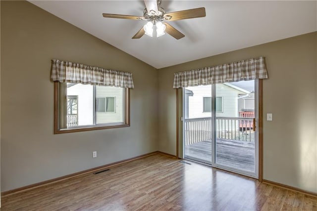 unfurnished room with light hardwood / wood-style flooring, ceiling fan, and lofted ceiling