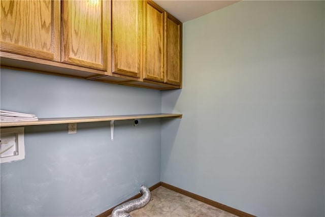 laundry room featuring hookup for a washing machine and cabinets