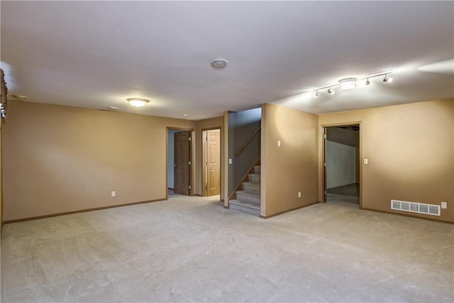 empty room featuring light colored carpet