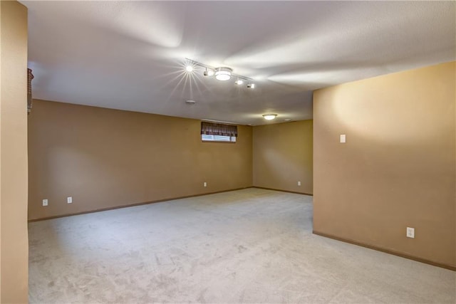 basement featuring light colored carpet