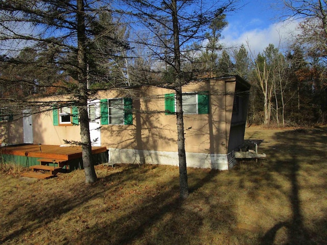 view of side of property with a deck