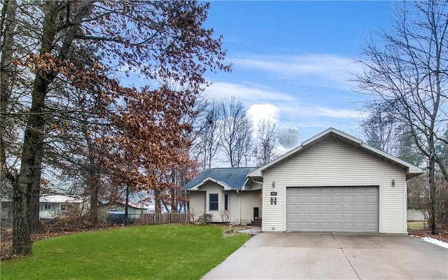 ranch-style house with a garage and a front lawn