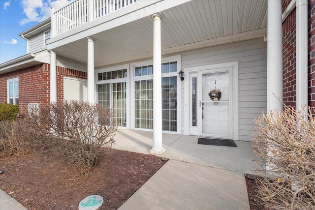 doorway to property with a balcony