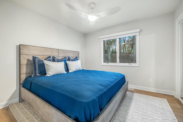 bedroom featuring wood-type flooring and ceiling fan