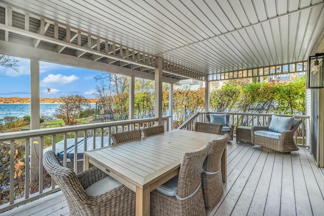 wooden deck featuring a water view