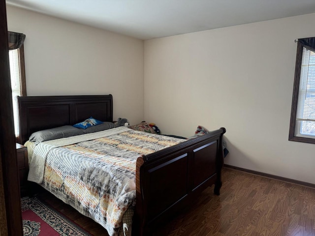 bedroom featuring dark hardwood / wood-style flooring