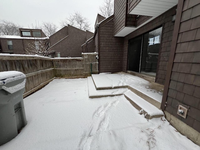 view of yard layered in snow