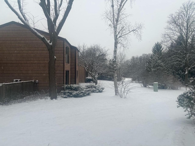 view of yard layered in snow