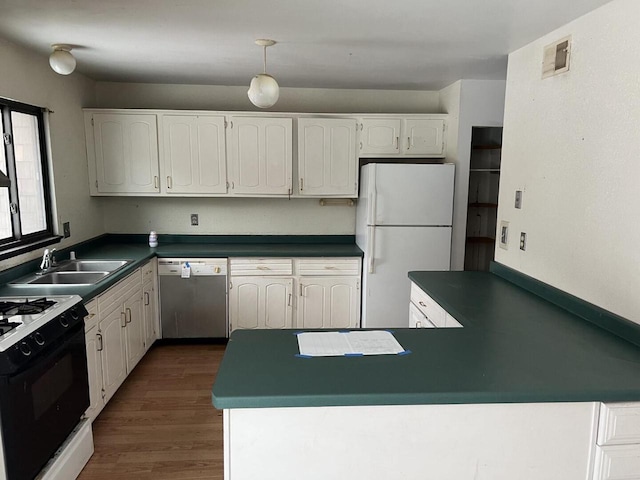 kitchen featuring white cabinetry, white appliances, and sink