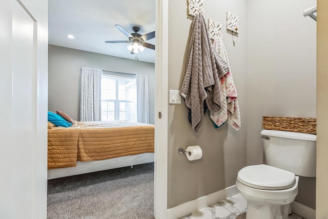 bathroom featuring ceiling fan and toilet