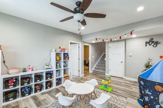 rec room featuring ceiling fan and hardwood / wood-style flooring